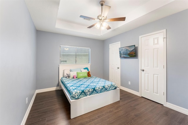 14619 Townsend Ct, Cypress, TX 77429 - bedroom featuring a raised ceiling, wood finished floors, and ceiling fan