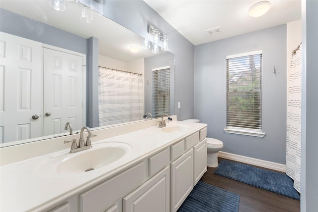 14619 Townsend Ct, Cypress, TX 77429 - bathroom with double vanity, wood finished floors, and a shower with curtain