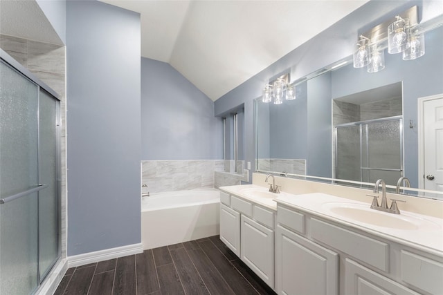 14619 Townsend Ct, Cypress, TX 77429 - full bathroom with a shower stall, double vanity, wood finish floors, a garden tub, and vaulted ceiling