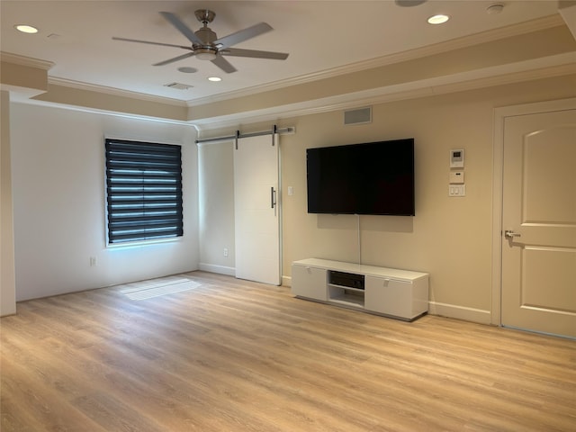 607 Oakley St Unit 5, Houston, TX 77006 - unfurnished living room featuring ornamental molding, a barn door, light wood-style flooring, a ceiling fan, and recessed lighting