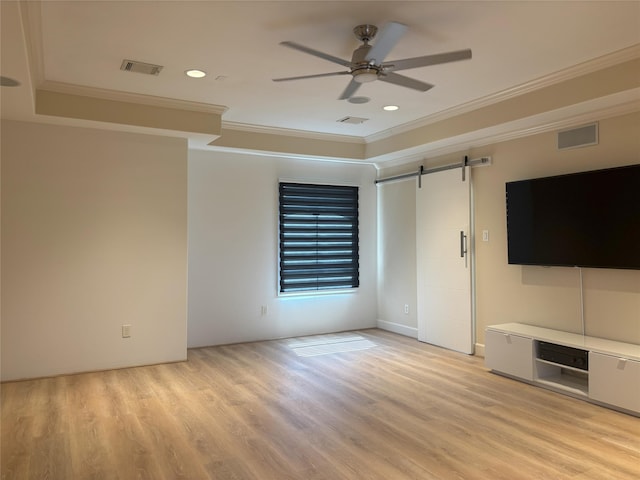 607 Oakley St Unit 5, Houston, TX 77006 - unfurnished living room featuring ornamental molding, a barn door, a ceiling fan, light wood finished floors, and recessed lighting