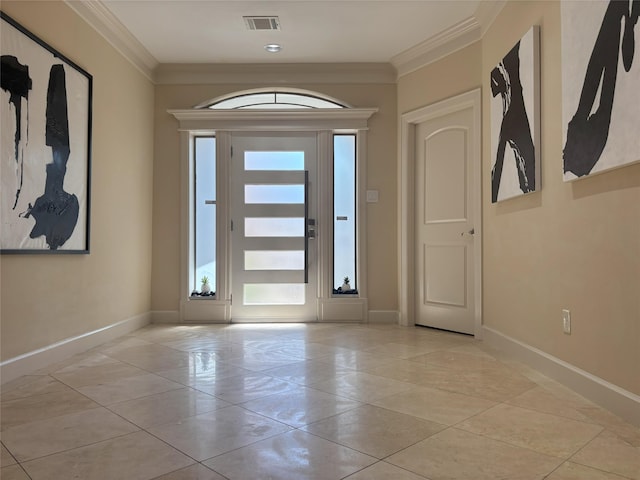 607 Oakley St Unit 5, Houston, TX 77006 - foyer entrance with ornamental molding and light tile patterned flooring
