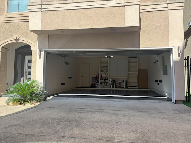 607 Oakley St Unit 5, Houston, TX 77006 - garage featuring driveway and electric panel
