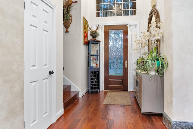 3402 Haywood Ct, Sugar Land, TX 77478 - foyer featuring wood finished floors and stairway
