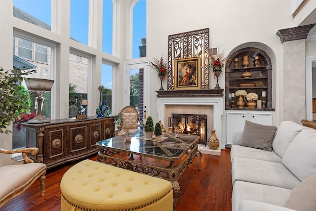 3402 Haywood Ct, Sugar Land, TX 77478 - living area featuring a fireplace, dark wood-type flooring, and a towering ceiling