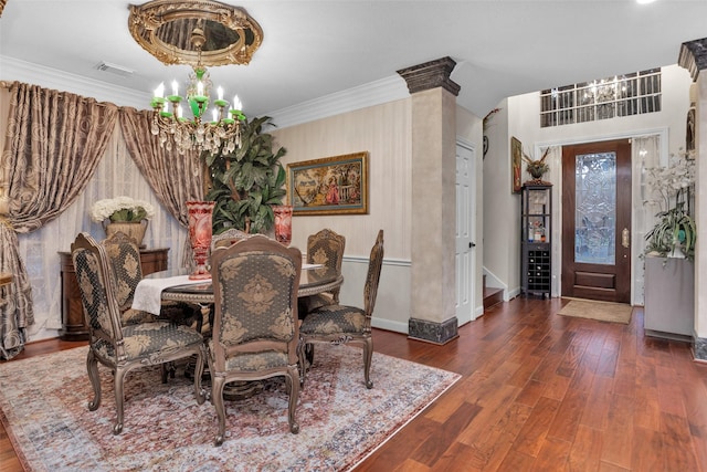 3402 Haywood Ct, Sugar Land, TX 77478 - dining area featuring a chandelier, crown molding, and wood finished floors