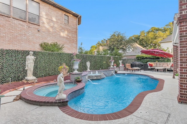 3402 Haywood Ct, Sugar Land, TX 77478 - view of swimming pool with a pool with connected hot tub, a patio area, outdoor lounge area, and a fenced backyard