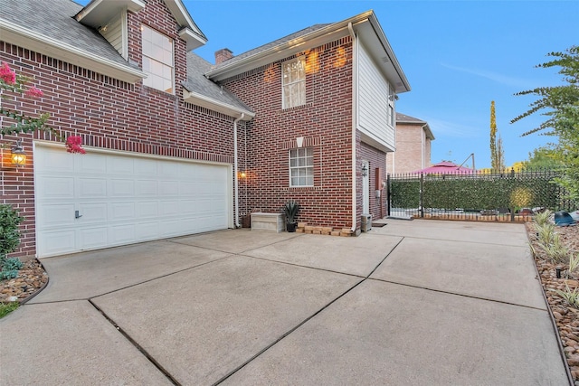 3402 Haywood Ct, Sugar Land, TX 77478 - view of property exterior with brick siding, concrete driveway, a garage, and roof with shingles
