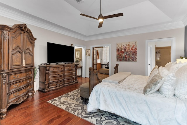 3402 Haywood Ct, Sugar Land, TX 77478 - bedroom with dark wood-type flooring, a tray ceiling, a ceiling fan, and crown molding