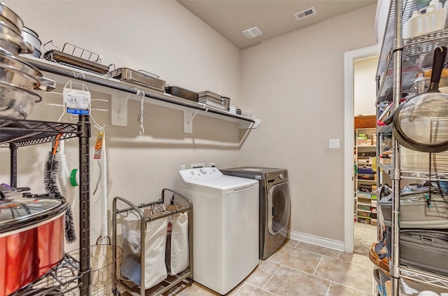 18115 Stari Most Ln, Houston, TX 77044 - washroom with separate washer and dryer and light tile patterned floors