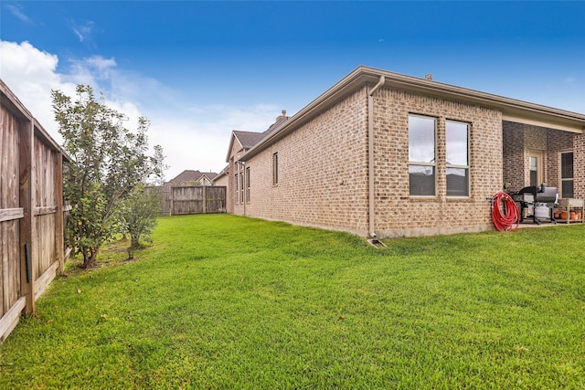 18115 Stari Most Ln, Houston, TX 77044 - view of side of home with brick siding and a fenced backyard