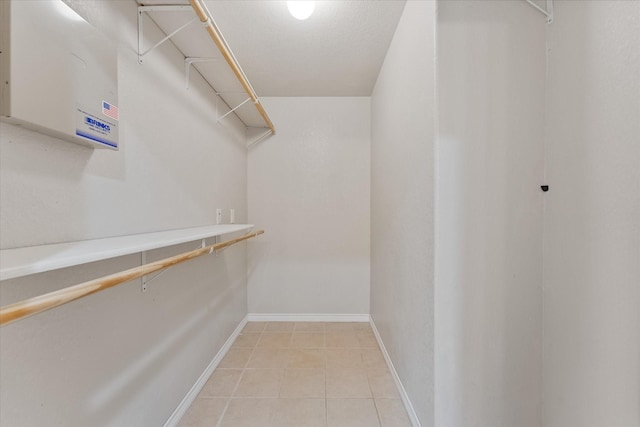 1503 Briar Cliff St, Conroe, TX 77385 - walk in closet featuring light tile patterned floors