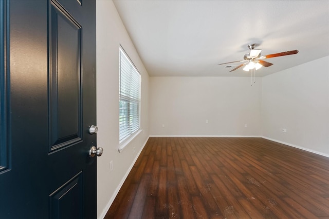1503 Briar Cliff St, Conroe, TX 77385 - spare room featuring a ceiling fan and dark wood-type flooring