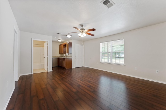 1503 Briar Cliff St, Conroe, TX 77385 - unfurnished living room with a ceiling fan and dark wood finished floors
