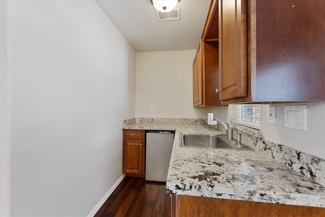 1503 Briar Cliff St, Conroe, TX 77385 - kitchen featuring dishwasher, brown cabinetry, and dark wood-style floors