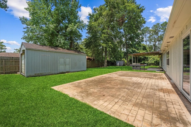 1503 Briar Cliff St, Conroe, TX 77385 - fenced backyard with a storage unit and a patio