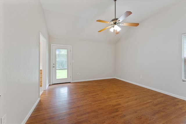 1503 Briar Cliff St, Conroe, TX 77385 - spare room featuring vaulted ceiling, wood finished floors, and a ceiling fan