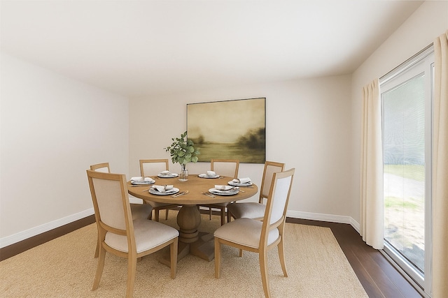 1503 Briar Cliff St, Conroe, TX 77385 - dining area featuring dark wood-style floors and baseboards
