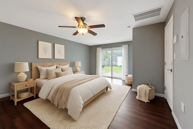1503 Briar Cliff St, Conroe, TX 77385 - bedroom with access to exterior, dark wood-type flooring, and a ceiling fan
