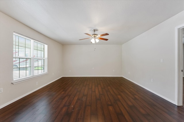 1503 Briar Cliff St, Conroe, TX 77385 - empty room with a ceiling fan and dark wood-style flooring