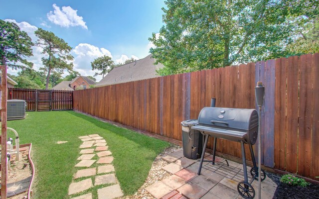 14022 Cypress Falls Dr, Cypress, TX 77429 - fenced backyard featuring a patio area