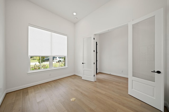 24914 Heather Glade Trl, Tomball, TX 77375 - unfurnished bedroom with light wood-type flooring and baseboards
