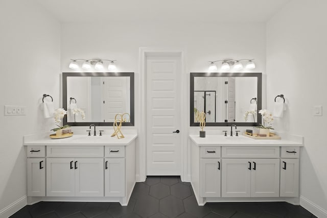 24914 Heather Glade Trl, Tomball, TX 77375 - bathroom featuring two vanities, tile patterned floors, and a shower stall