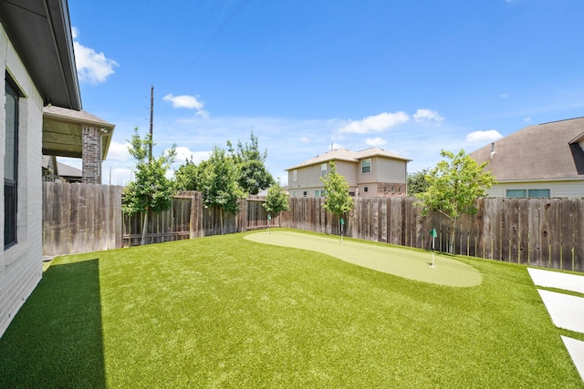 24914 Heather Glade Trl, Tomball, TX 77375 - fenced backyard featuring a putting green