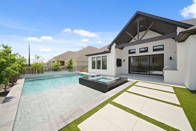 24914 Heather Glade Trl, Tomball, TX 77375 - view of swimming pool featuring a patio, a fenced backyard, and a pool with connected hot tub
