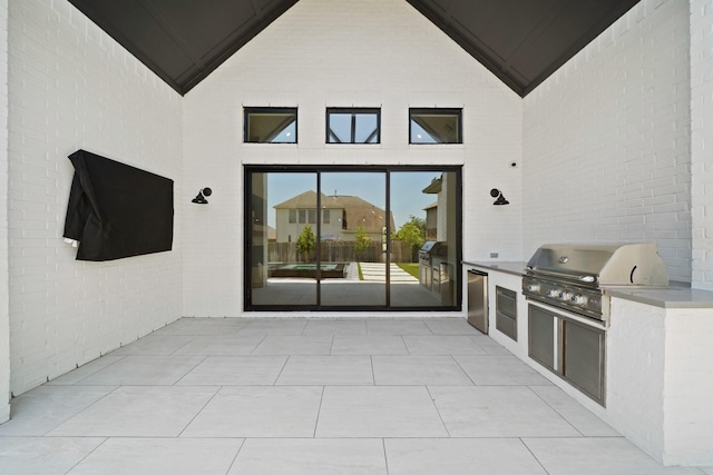 24914 Heather Glade Trl, Tomball, TX 77375 - view of patio featuring exterior kitchen