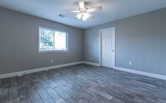 28906 Champion Oaks Dr, Magnolia, TX 77354 - empty room with a ceiling fan and dark wood-style floors