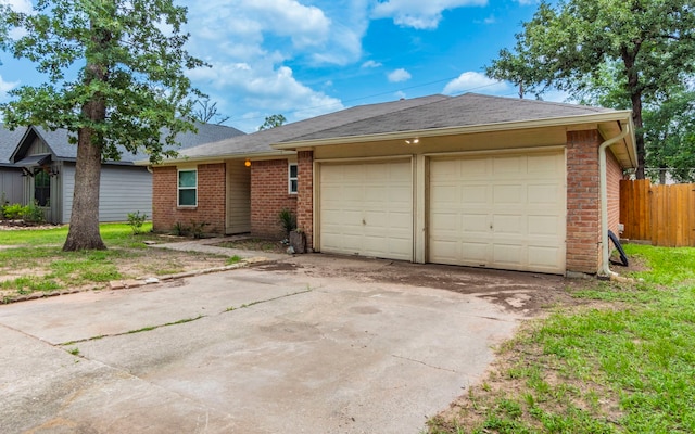 28906 Champion Oaks Dr, Magnolia, TX 77354 - ranch-style home with a garage, brick siding, driveway, and a shingled roof