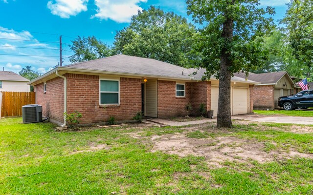 28906 Champion Oaks Dr, Magnolia, TX 77354 - ranch-style house with concrete driveway, a garage, brick siding, and roof with shingles