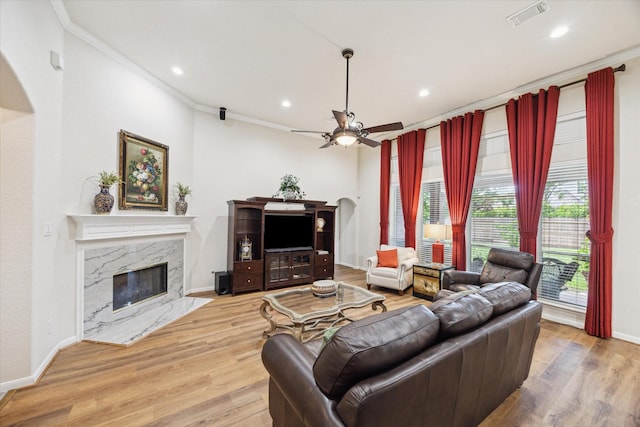 1815 Hanover Springs Ln, Richmond, TX 77406 - living room featuring ornamental molding, ceiling fan, wood finished floors, a high end fireplace, and recessed lighting