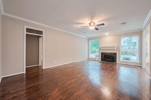 6018 Rapid Creek Ct, Houston, TX 77345 - unfurnished living room with wood finished floors, ceiling fan, a textured ceiling, a tile fireplace, and ornamental molding