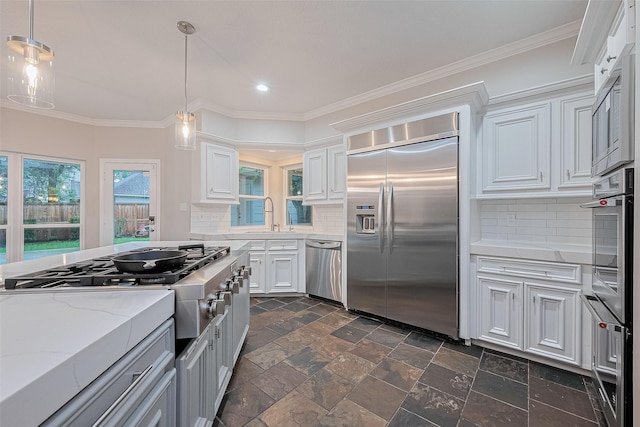 6018 Rapid Creek Ct, Houston, TX 77345 - kitchen featuring stainless steel appliances, recessed lighting, backsplash, crown molding, and white cabinetry
