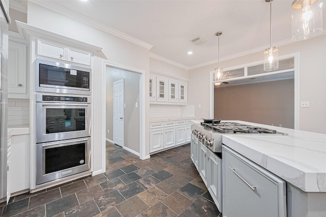 6018 Rapid Creek Ct, Houston, TX 77345 - kitchen with stainless steel appliances, recessed lighting, crown molding, white cabinetry, and backsplash