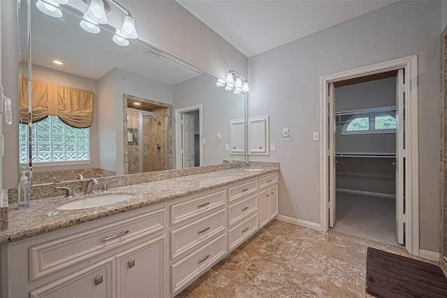 6018 Rapid Creek Ct, Houston, TX 77345 - bathroom featuring a shower stall, double vanity, and healthy amount of natural light