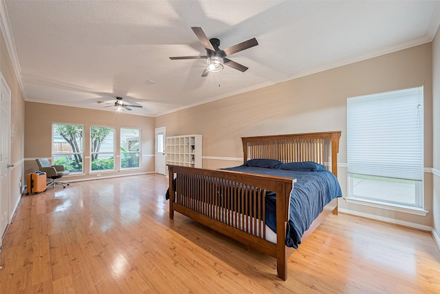 6018 Rapid Creek Ct, Houston, TX 77345 - bedroom featuring wood finished floors, ornamental molding, and ceiling fan