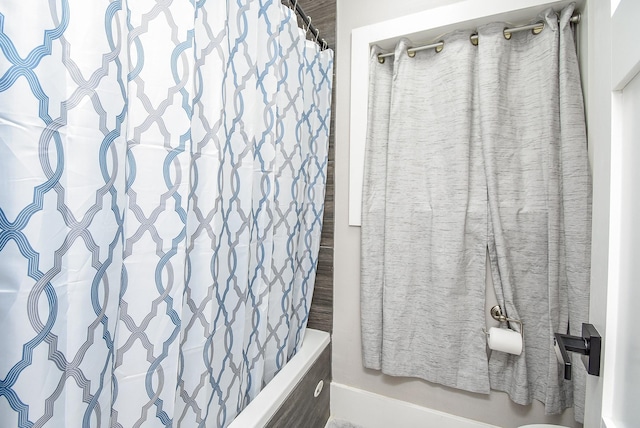 7618 Highmeadow Dr, Houston, TX 77063 - full bath featuring shower / bath combo with shower curtain and baseboards