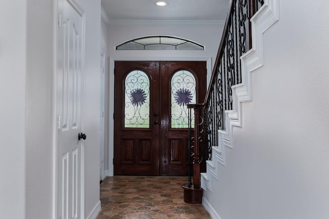 1600 Wimbledon Dr, Huntsville, TX 77340 - entrance foyer with dark stone finish flooring, stairway, and ornamental molding