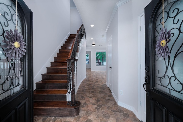 1600 Wimbledon Dr, Huntsville, TX 77340 - foyer featuring dark stone finish flooring, stairs, recessed lighting, and crown molding