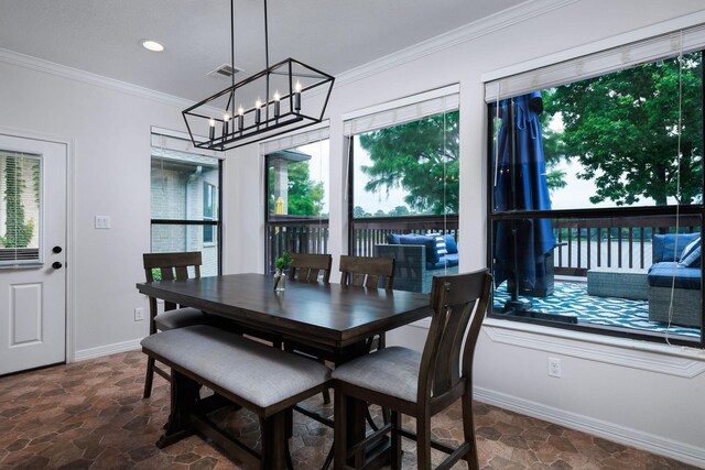 1600 Wimbledon Dr, Huntsville, TX 77340 - dining room with dark stone finish floors, ornamental molding, plenty of natural light, a chandelier, and recessed lighting