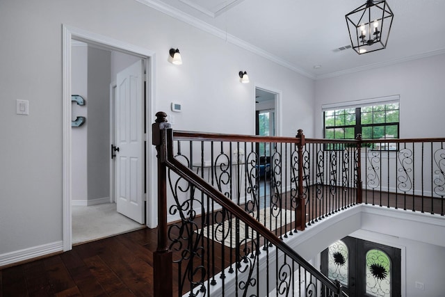 1600 Wimbledon Dr, Huntsville, TX 77340 - hall with dark wood-type flooring, an upstairs landing, crown molding, and a chandelier