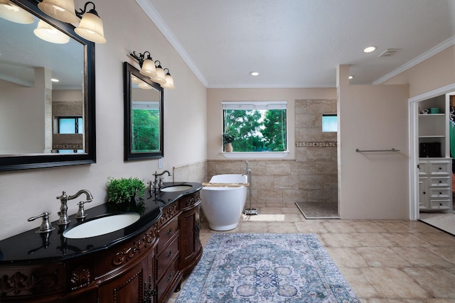 1600 Wimbledon Dr, Huntsville, TX 77340 - full bath with double vanity, walk in shower, a soaking tub, ornamental molding, and tile walls