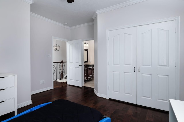 1600 Wimbledon Dr, Huntsville, TX 77340 - unfurnished bedroom with dark wood-type flooring, ornamental molding, and a closet