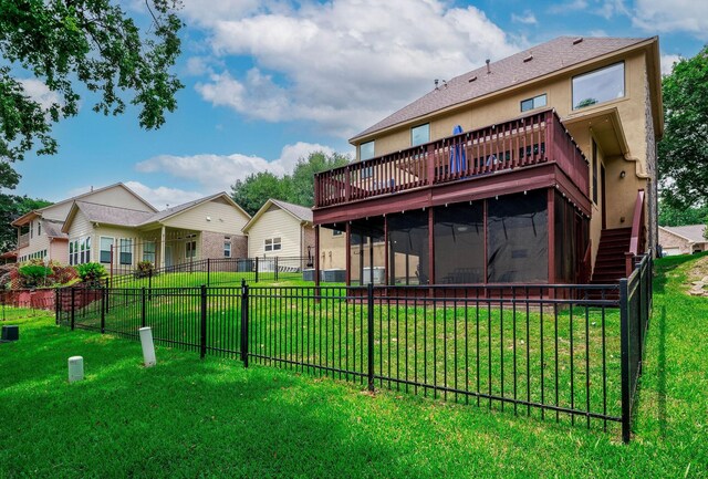 1600 Wimbledon Dr, Huntsville, TX 77340 - back of house with a wooden deck, a sunroom, a fenced backyard, and stairway