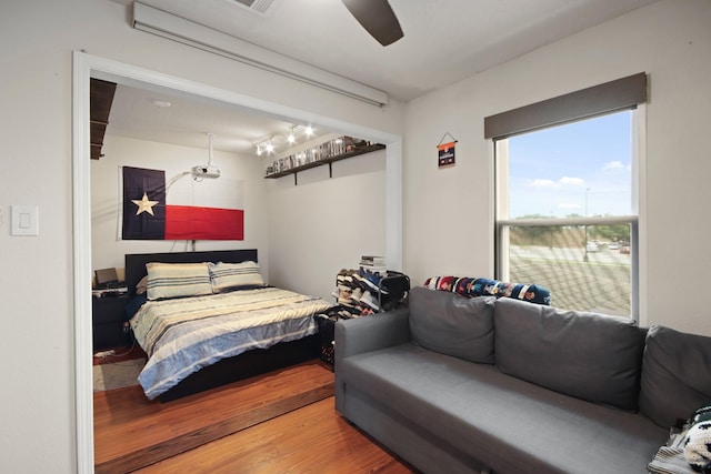 1202 Fairlane Sq, Channelview, TX 77530 - bedroom featuring wood finished floors and ceiling fan