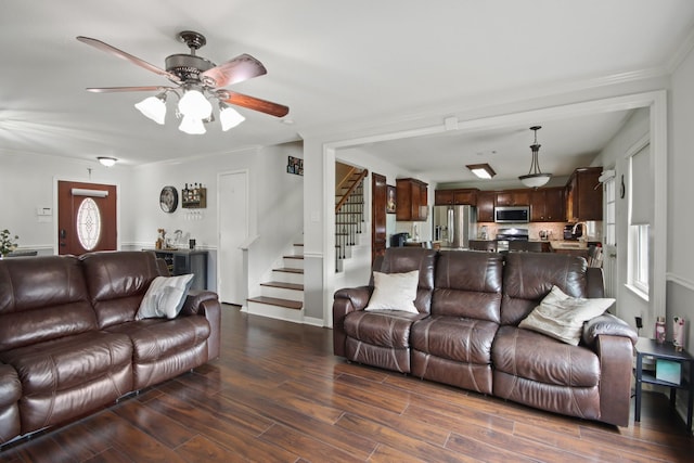 1202 Fairlane Sq, Channelview, TX 77530 - living room with stairway, dark wood-type flooring, ceiling fan, and crown molding