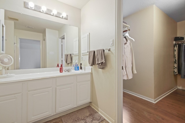 1202 Fairlane Sq, Channelview, TX 77530 - full bath featuring double vanity, wood finished floors, and a spacious closet